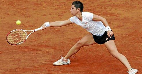 Carla Suárez busca el golpeo en un peloteo con Bouchard. Carla Suárez busca el golpeo en un peloteo con Bouchard.